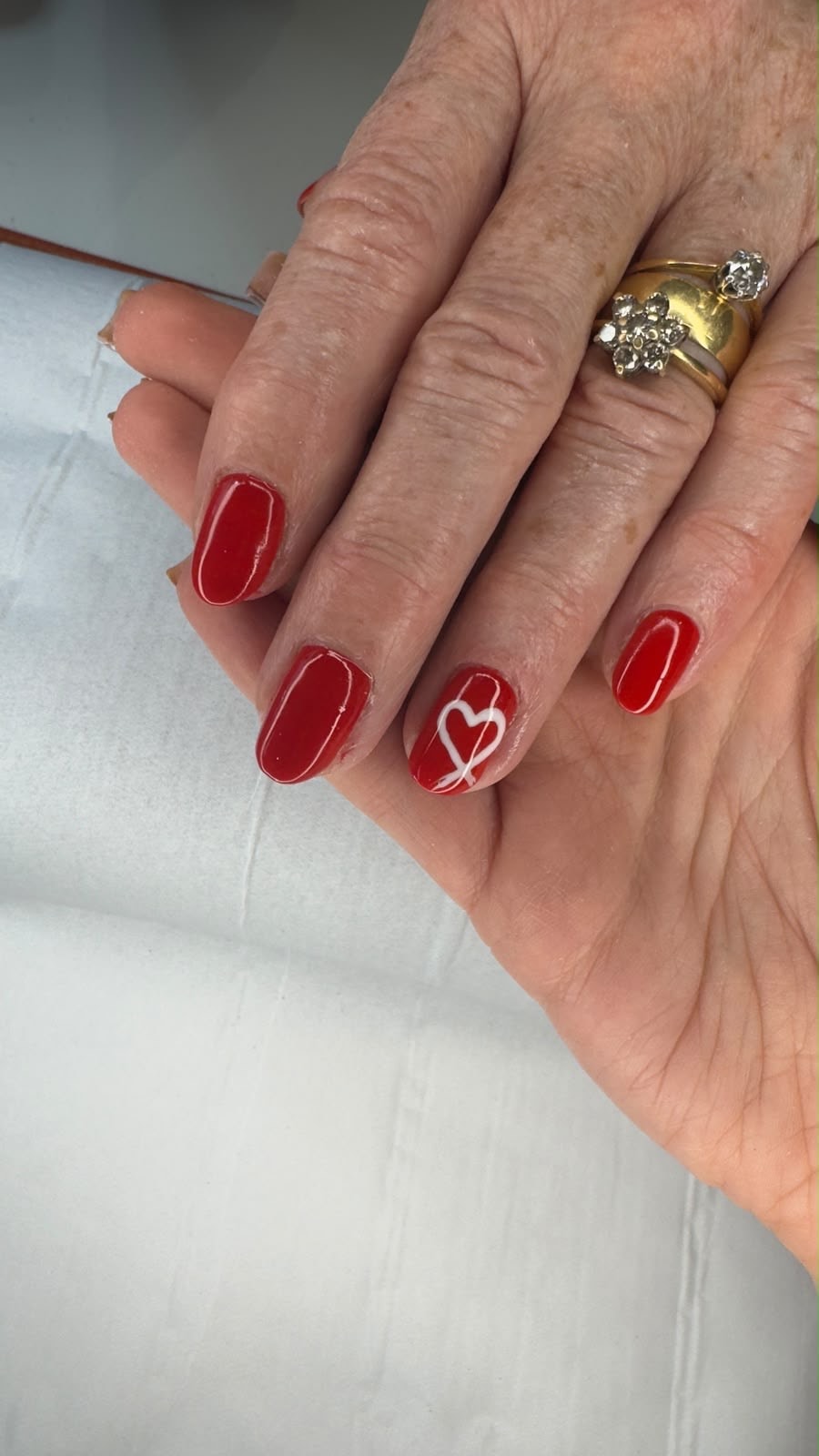 Red nails with a white heart