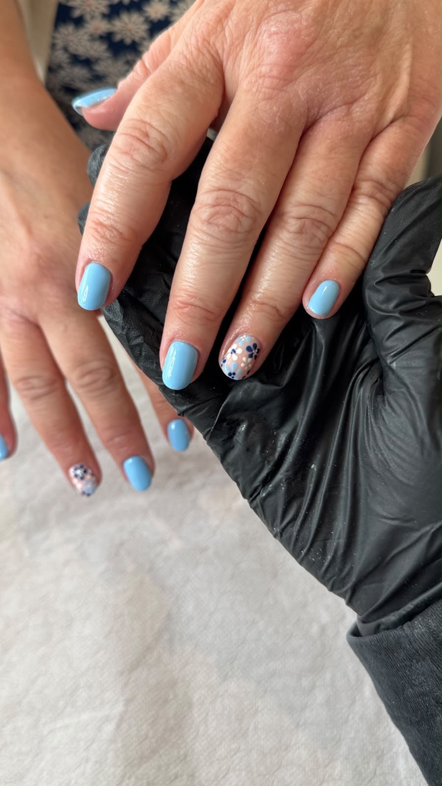 Sky blue nails with floral details